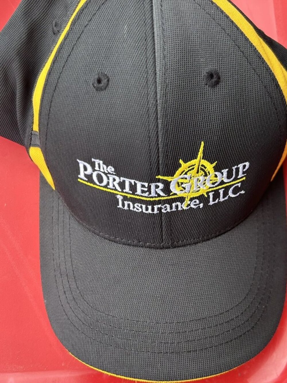 Sport-Tek Porter Group Insurance Black Yellow Cap
